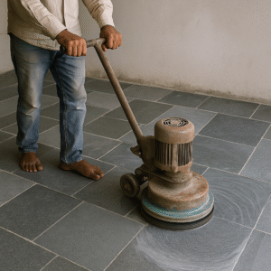 Worker polishing Kota stone flooring with grinding machine